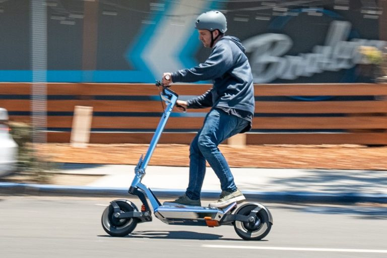 man riding Apollo Pro electric scooter