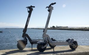 Two gotrax scooters: gotrax gx1 and gotrax gx2 side by side.
